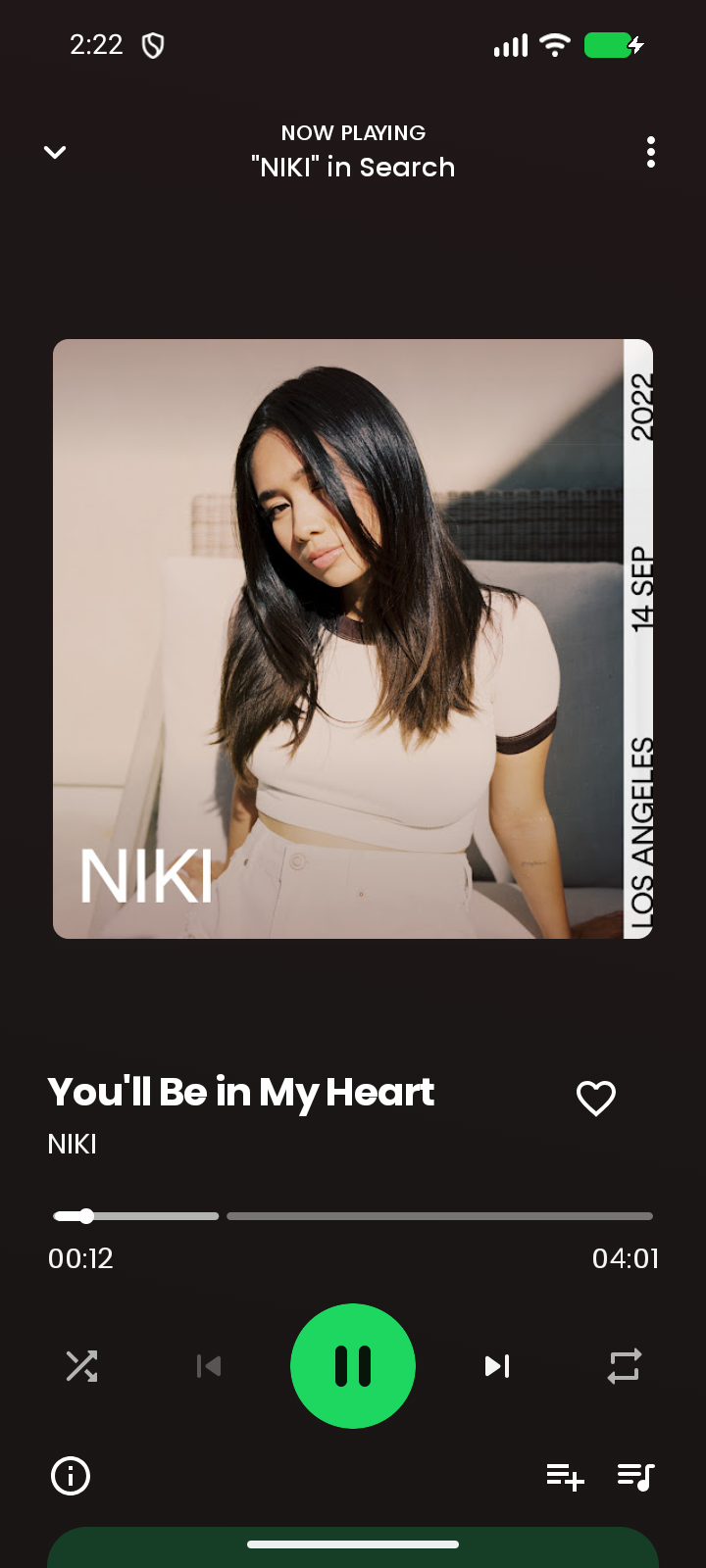 Now Playing Gratify saat lagu You'll Be in My Heart oleh NIKI diputar, dengan sampul album dan kontrol musik